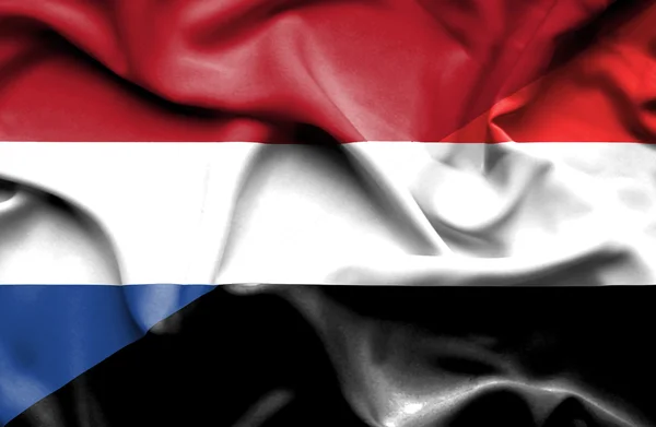 Flagge des Jemen und der Niederlande schwenken — Stockfoto