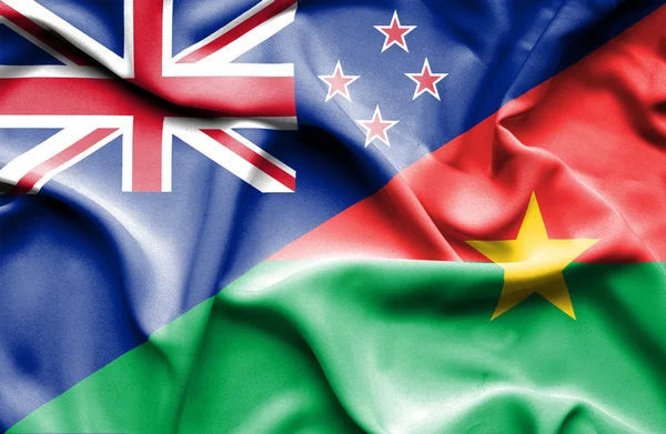 Bandeira acenando de Burkina Faso e Nova Zelândia — Fotografia de Stock