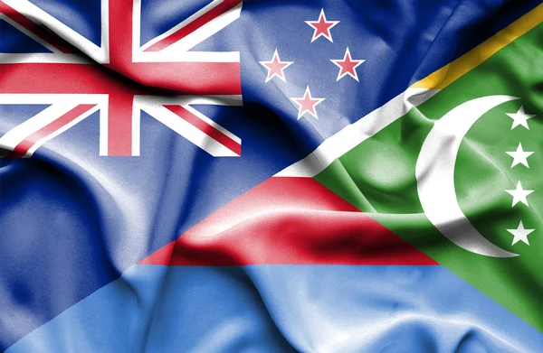 Waving flag of Comoros and New Zealand — Stock Photo, Image