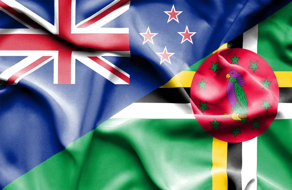 Waving flag of Dominica and New Zealand — Stock Photo, Image