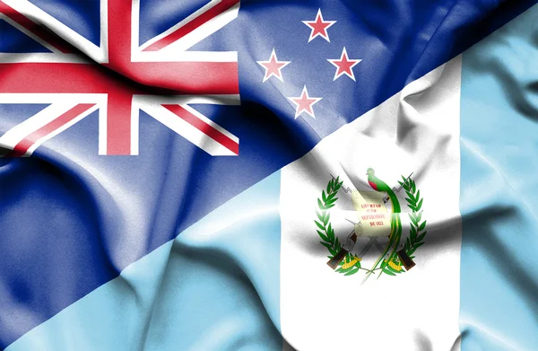 Waving flag of Guatemala and New Zealand — Stock Photo, Image