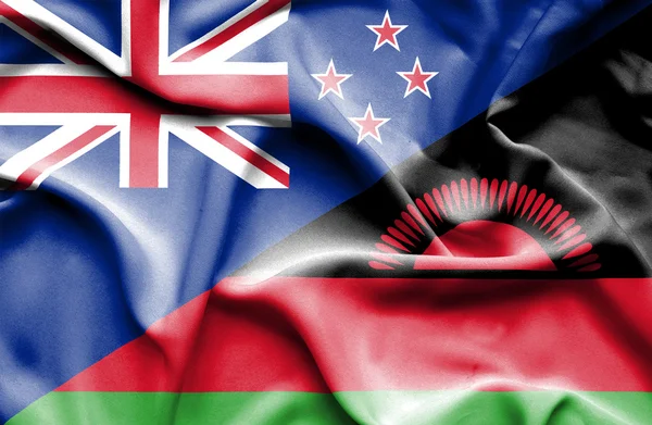 Wapperende vlag van malawi en Nieuw-Zeeland — Stockfoto