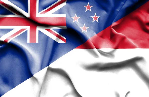 Waving flag of Monaco and New Zealand — Stock Photo, Image