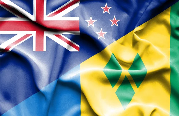 Wapperende vlag van saint vincent en grenadines en Nieuw-Zeeland — Stockfoto