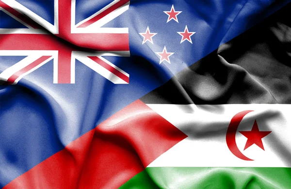 西サハラ、ニュージーランドの旗を振っています。 — ストック写真
