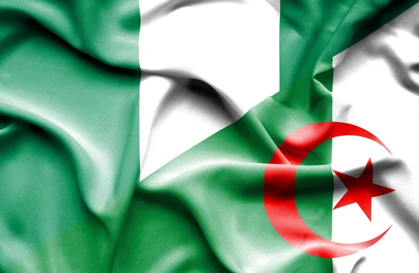 Wapperende vlag van Algerije en nigeria — Stockfoto