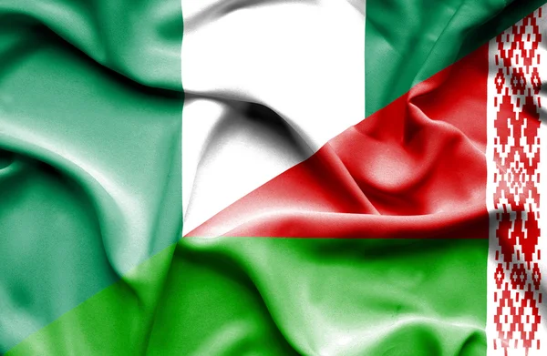 Wapperende vlag van Wit-Rusland en nigeria — Stockfoto