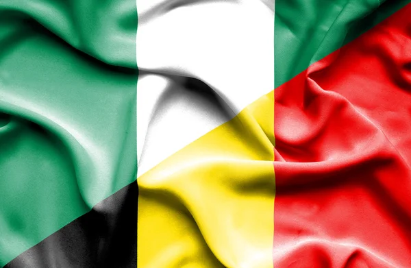 Bandiera sventolante di Belgio e Nigeria — Foto Stock