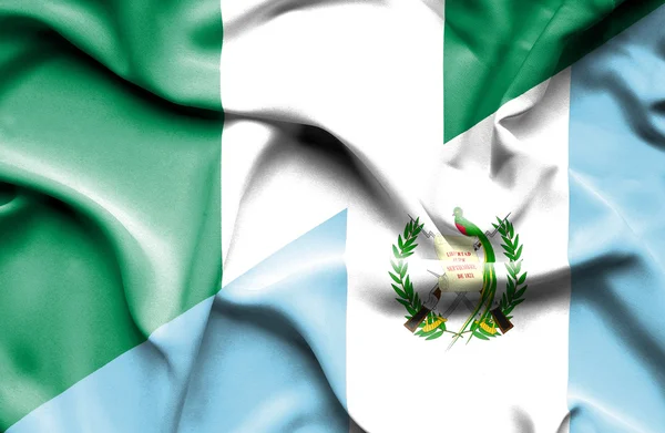 Waving flag of Guatemala and Nigeria — Stock Photo, Image