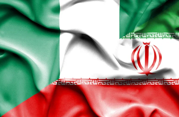 イランとナイジェリアの旗を振っています。 — ストック写真