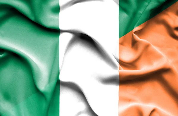 Waving flag of Ireland and Nigeria — Stock Photo, Image