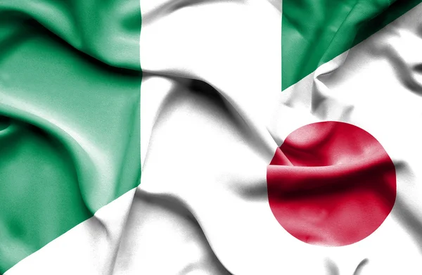 Wapperende vlag van japan en nigeria — Stockfoto