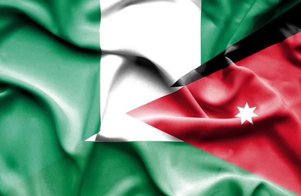 Wapperende vlag van Jordanië en nigeria — Stockfoto