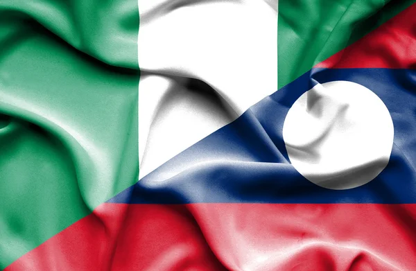 Flagge von Laos und Nigeria schwenken — Stockfoto
