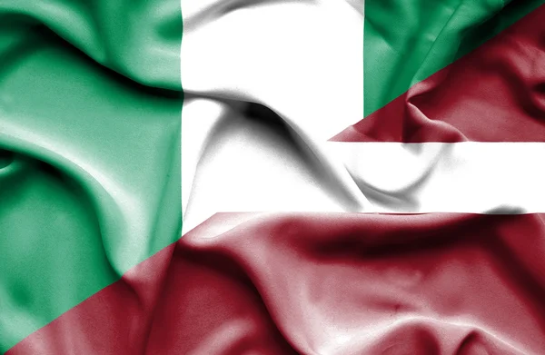 Bandera ondeante de Letonia y Nigeria —  Fotos de Stock