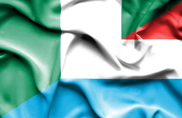 Luxemburg och nigeria viftande flagga — Stockfoto