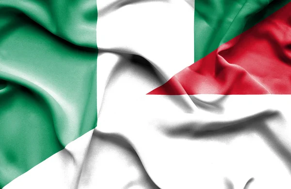 摩纳哥和尼日利亚那飘扬的旗帜 — 图库照片