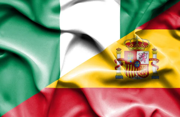 Waving flag of Spain and Nigeria — Stock Photo, Image