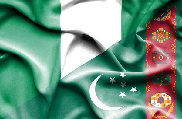 Waving flag of Turkmenistan and Nigeria — Stock Photo, Image