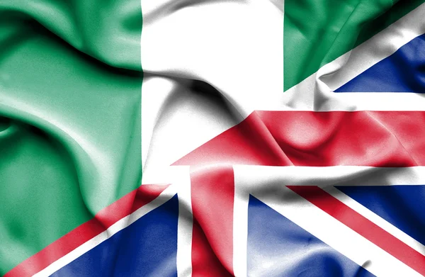 युनायटेड किंगडम आणि नायजेरियाचा झेंडा लपवून — स्टॉक फोटो, इमेज
