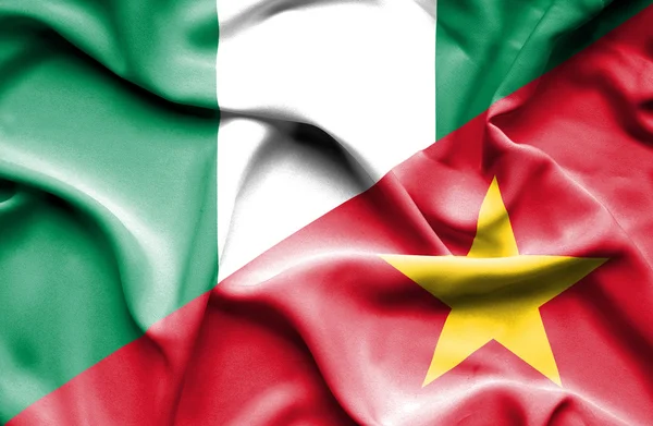 Flagge Vietnams und Nigerias schwenken — Stockfoto