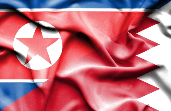 バーレーン、北朝鮮の旗を振ってください。 — ストック写真