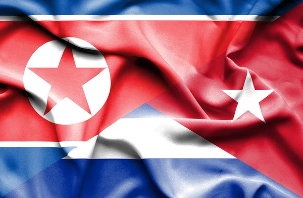 Flagge Kubas und Nordkoreas schwenken — Stockfoto