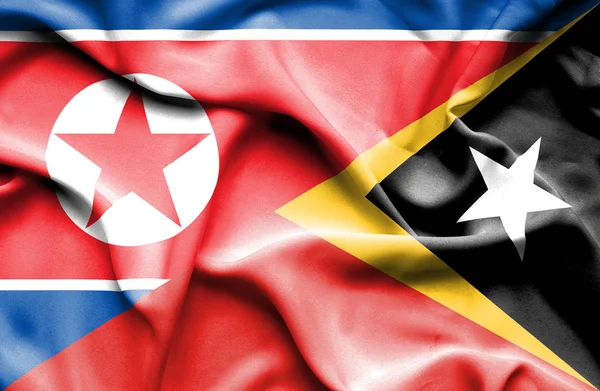 Flagge von Osttimor undNordkorea schwenken — Stockfoto