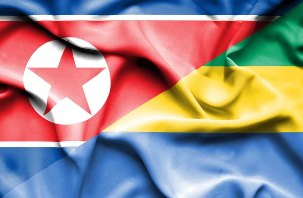 Waving flag of Gabon and North Korea — Stock Photo, Image