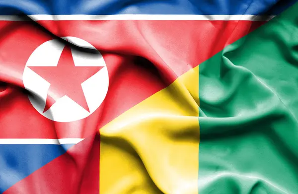 Waving flag of Guinea and North Korea — Stock Photo, Image