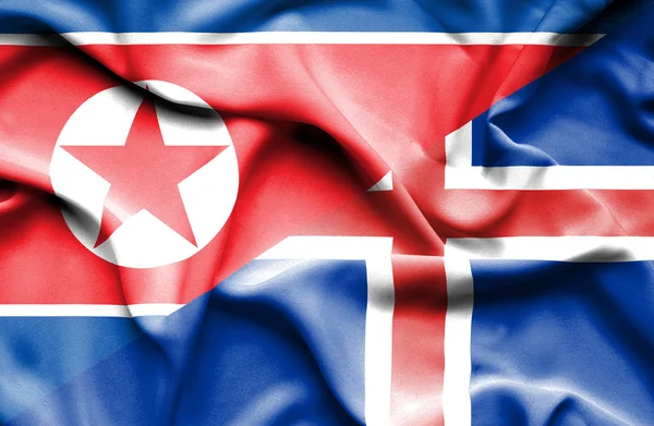 アイスランドと北朝鮮の旗を振っています。 — ストック写真