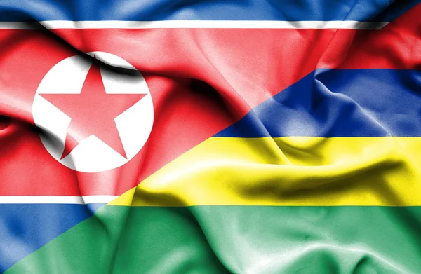 Waving flag of Mauritius and North Korea — Stock Photo, Image