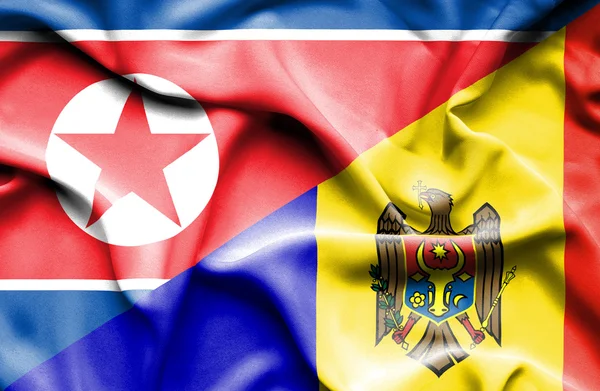 Flagge Moldawiens und Nordkoreas schwenken — Stockfoto