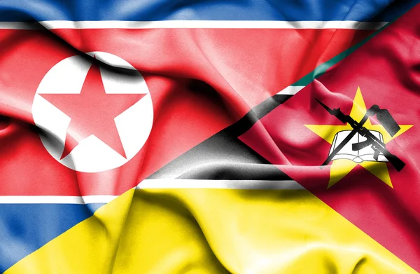 Waving flag of Mozambique and North Korea — Stock Photo, Image