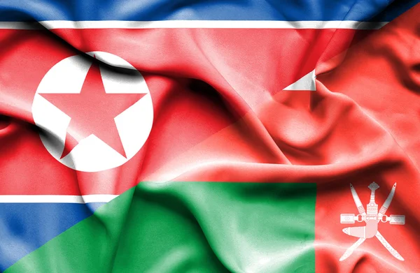 Ondeando la bandera de Omán y Corea del Norte — Foto de Stock