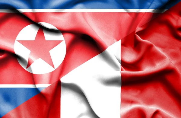 Bandeira acenando do Peru e da Coreia do Norte — Fotografia de Stock