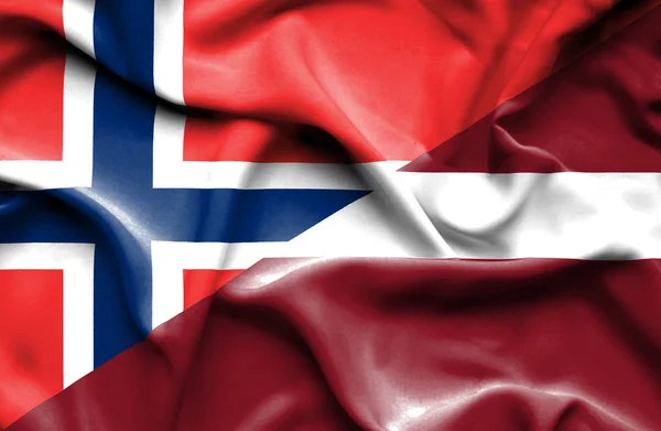 Lettland och Norge viftande flagga — Stockfoto