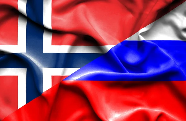Ondeando la bandera de Rusia y Noruega — Foto de Stock