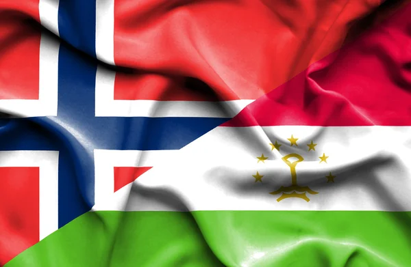 Tádzsikisztán és Norvégia hullámzó zászlaja — Stock Fotó
