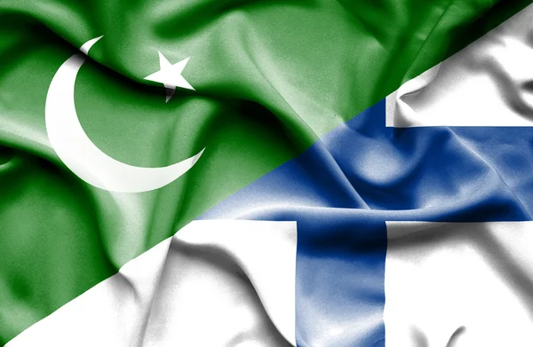 Finlandiya ve pakistan bayrağı sallayarak — Stok fotoğraf