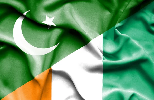 Mávání vlajkou Pobřeží slonoviny a Pákistánu — Stock fotografie