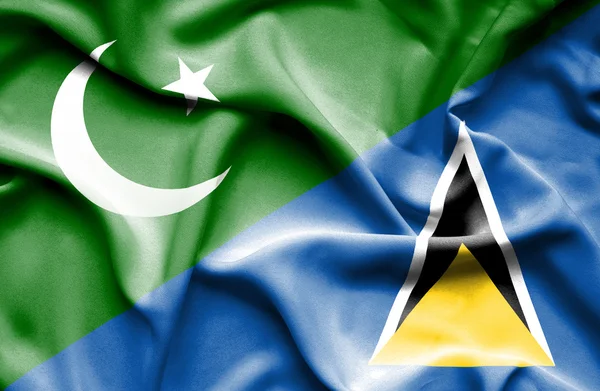 Waving flag of St Lucia and Pakistan — Stock Photo, Image