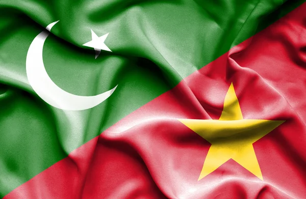 Vlající vlajka Vietnamu a Pákistánu — Stock fotografie