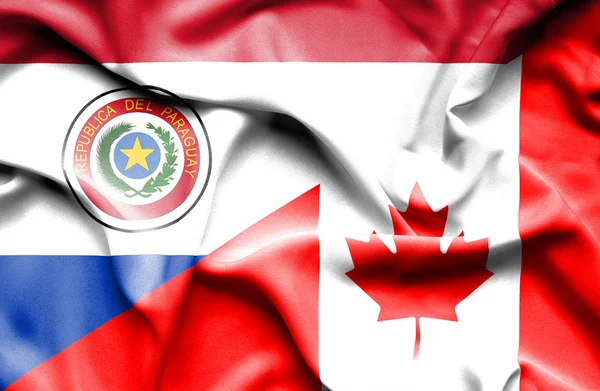 Vlající vlajka Kanady a paraguay — Stock fotografie