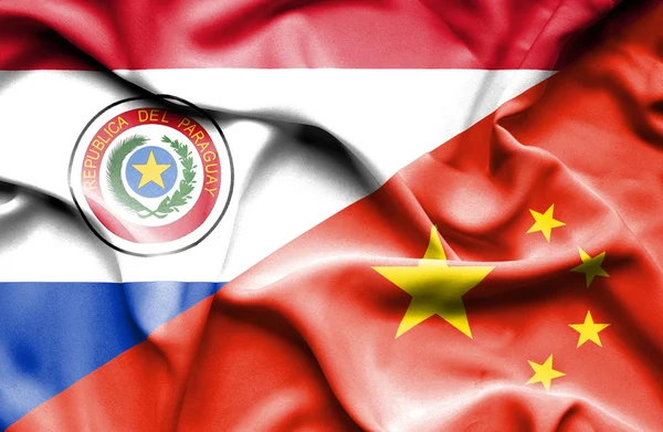 Kina och paraguay viftande flagga — Stockfoto