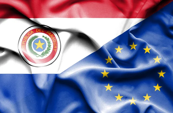 Waving flag of European Union and Paraguay — Stock Photo, Image