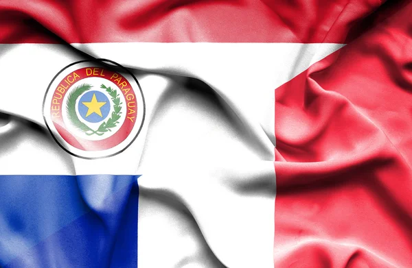 Mávání vlajkou Francie a paraguay — Stock fotografie