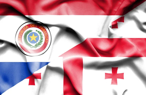 Wapperende vlag van Georgië en paraguay — Stockfoto