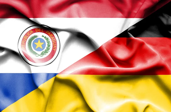 Wapperende vlag van Duitsland en paraguay — Stockfoto