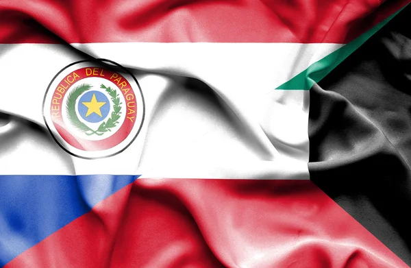 Mávání vlajkou Kuvajtu a paraguay — Stock fotografie